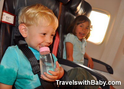 flying-Alaska-Airlines-kids Little kids flying on Alaska Airlines 737 returning from Kauai at TravelswithBaby.com