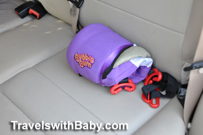 bubble-bum-rolled-seat The Bubble Bum shown deflated and rolled in comparison with the car's seat.