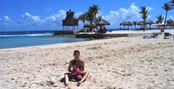 Mama Shelly on tot patrol on the white sand beach of Dreams Puerto Aventuras, Riviera Maya Mexico www.travelswithbaby.com